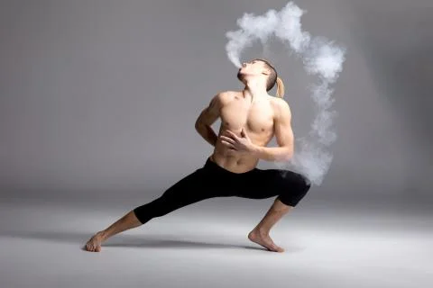 Young man vaping Stock Photos