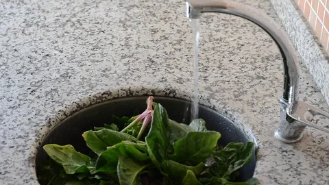 Young man vegetables to make herself a healthy cook at home Stock Footage 81193597