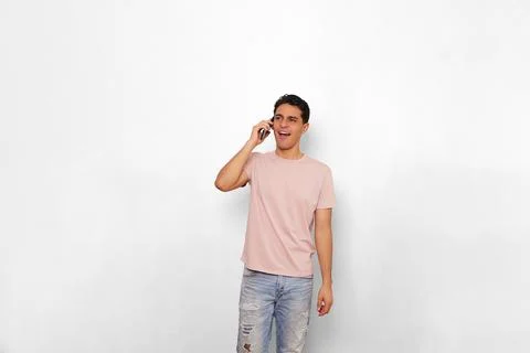 Young man very happy using his smartphone very smiling face Stock Photos