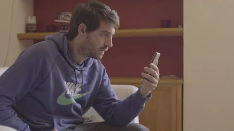 Young Man In A Video Call Thru His Cellphone Stock Footage 137441567