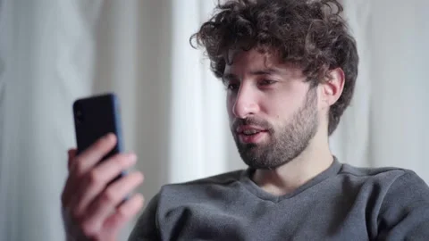 Young Man Video Calling on Smartphone Video stock 147104834