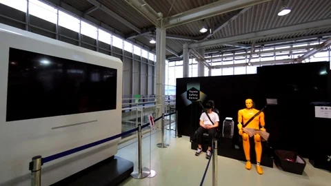 Young man with virtual reality glasses on his face in Toyota Mega Web. Tokyo Stock Footage