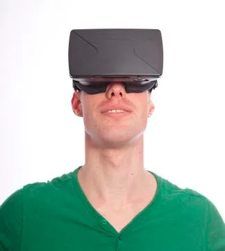 Young man with virtual reality glasses on white background Stock Photos