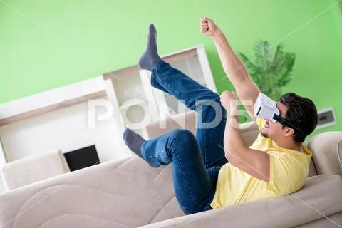 Young man with virtual reality goggles Stock Photos