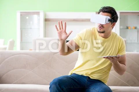 Young man with virtual reality goggles Stock Photos