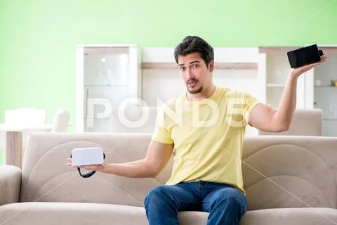Young man with virtual reality goggles Stock Photos