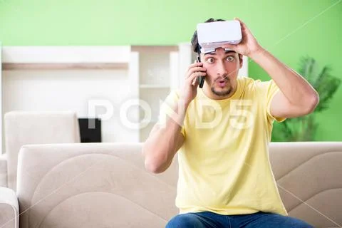 Young man with virtual reality goggles Stock Photos