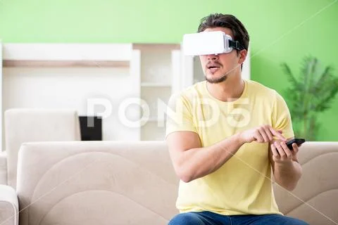 Young man with virtual reality goggles Stock Photos
