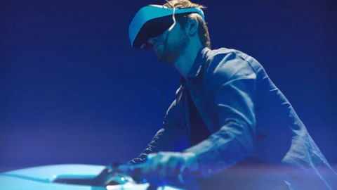 Young man in virtual reality headset playing videogame Stock Footage 106012102