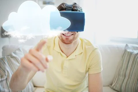Young man in virtual reality headset or 3d glasses Stock Photos