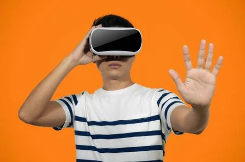 Young man with virtual reality headset. Stock Photos