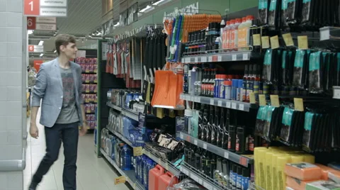 A young man visiting the store Stock Footage 67981486