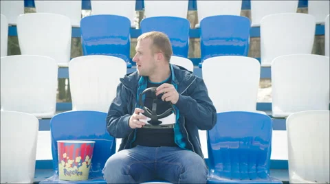 A young man in VR glasses at the stadium Stock Footage 63840110