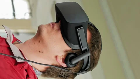 Young man in VR headset playing virtual game Stock-Footage 91160466