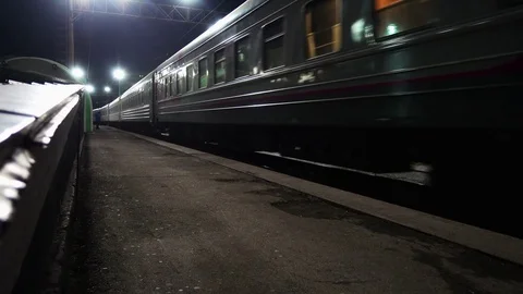 Young Man Is Waiting For Train At Night. Видео 75801145