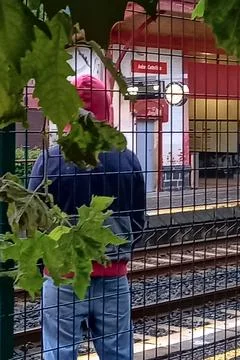 Young man waiting for the train Stock Photos