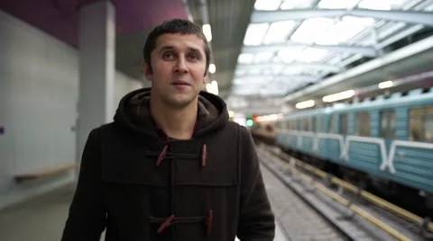 Young man waiting train in a subway station Stock Footage 68458662