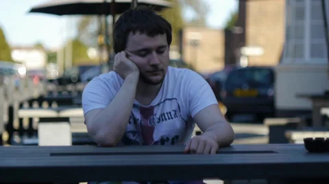 Young Man Waits Endlessly for Date Stock Footage 39890186