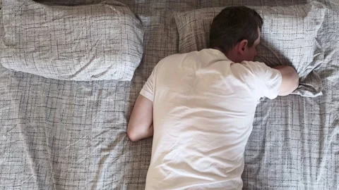 Young man wakes up in the morning in an empty bed and looking his girlfriend 스톡 동영상 132893259