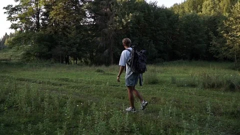 Young man walking after sunset, Carpathian mountains Stock Footage 114631453