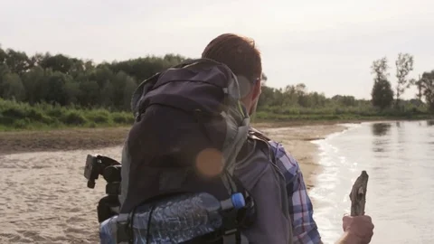 Young Man Walking Ahead in the Wild Stock Footage 76466923