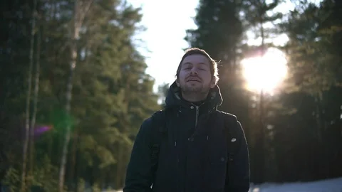 Young man walking alone in winter forest. Stock Footage 93328886