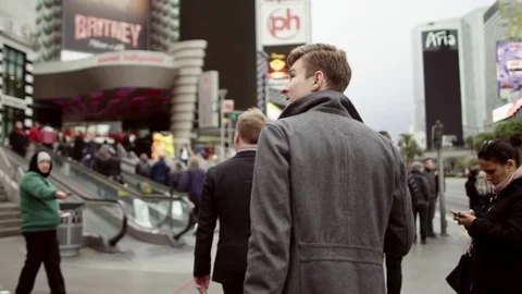 Young man is walking and looking around in Las Vegas Video stock 76206962