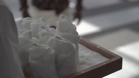 A young man walking and taking a white wet towel for face refreshment at the  Stock Footage 141654572