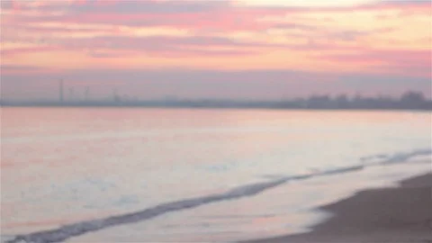 Young man walking on the beach at evening in winter. Stock-Footage 71132582