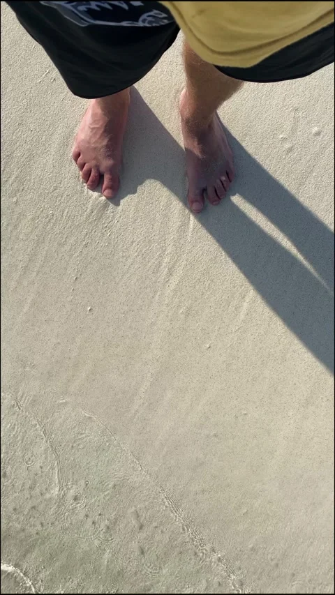 Young man walking on the beach Stock Footage 277800335