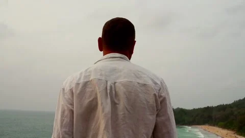 Young man walking on the beach, super slow motion Видео 101339759