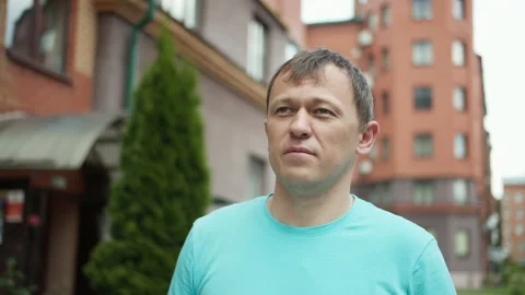 Young man walking in the city, camera tracking Stock Footage 151208823