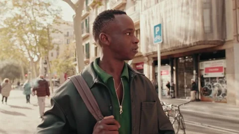 Young Man Walking Down City Street Stock Footage 320889433