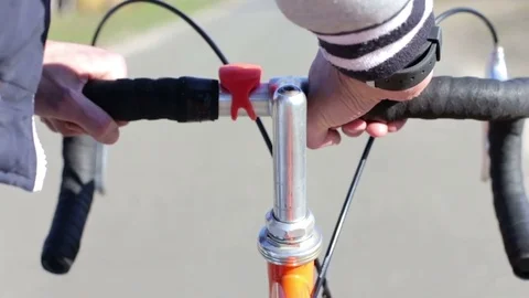 A young man walking down the street with a bicycle Stock Footage 74127003