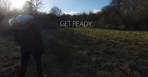 Young man walking up to "Get Ready" camera follows him - 1 Stock-Footage 73483664