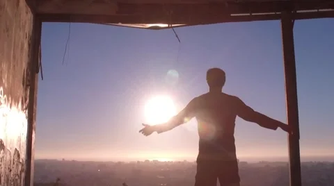 Young man walking inside an abandoned building opening his arms slowmotion 120fp Stock Footage 67358935