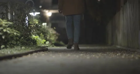 Young man walking in the night Stock Footage 149242972