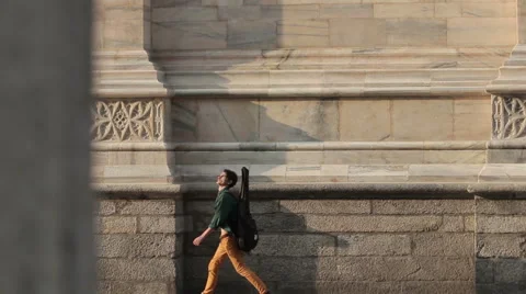 A young man walking in old town. Milan, Italy Stock Footage 60240083
