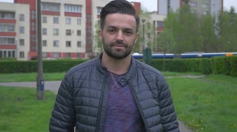 Young man walking in the park Video stock 62735843
