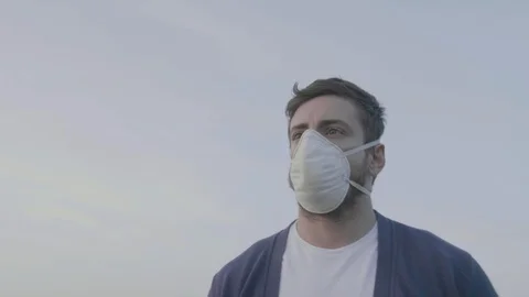 Young Man Walking with Protective Mask for Prevention Against Coronavirus 1 Видео 127024681