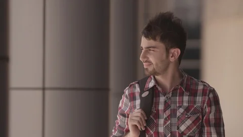 Young man walking with rucksack. Video stock 90802613