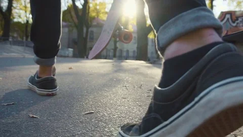 Young man walking with skateboard 動画素材 70121036