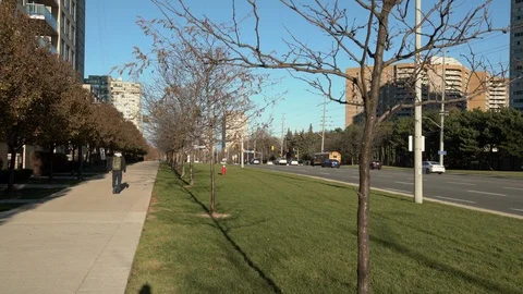Young man walking on stone sidewalk.  A7R360 Stock Footage 96351750