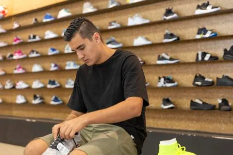 Young man walking in the store Stock Photos