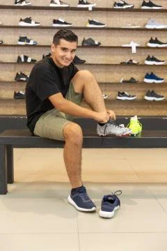 Young man walking in the store Stock Photos