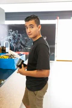 Young man walking in the store Stock Photos