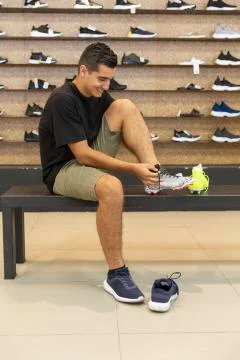Young man walking in the store Stock Photos