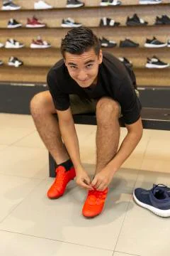 Young man walking in the store Stock Photos