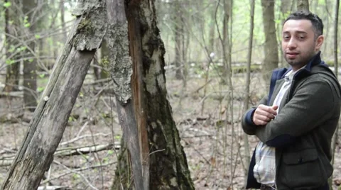 Young Man walking through the woods alone Stock Footage 49776589