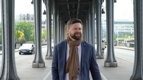 Young man is walking under the bridge of Bir-Hakeim in Paris Stock Footage 107433266